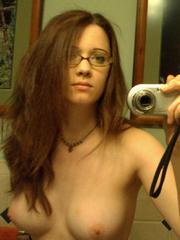 Cute teen in glasses with nude young tits takes